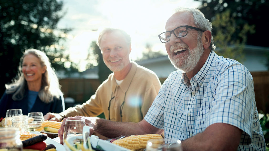 A group of older adults happily socializing